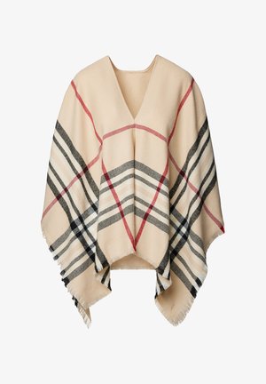 Beżowy wełniany ponczo z dekoltem w serek. Posiada klasyczny wzór w kratę w kolorach czerwonym, czarnym i beżowym, z frędzlami na krawędziach.