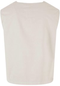 Gilet beige sans manches avec un large col et un ourlet droit, montré de dos.