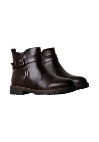 Bruine leren enkelboots met een gladde afwerking, voorzien van een zijriem met een gesp en een textuuraccent, en een duurzame rubberen zool.