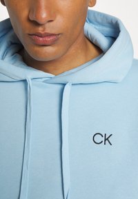 Calvin Klein Golf PLANET SPORTS SUIT - Trenirka - air blue