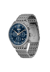 Montre en acier inoxydable avec un cadran bleu, trois sous-cadrans, des accents dorés et un bracelet à maillons argentés. Affichage de la date à la position 6 heures.