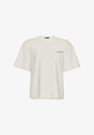 Biała, oversize'owa koszulka z krótkim rękawem, okrągłym dekoltem i małym czarnym logo "La Mania" na lewej piersi.