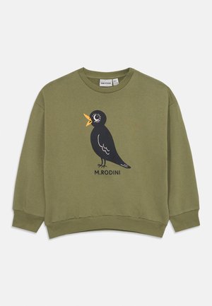 Sweatshirt verde-oliva em algodão com um gráfico de um pássaro preto, bico e olhos laranja, e o texto "M. RODINI" abaixo.