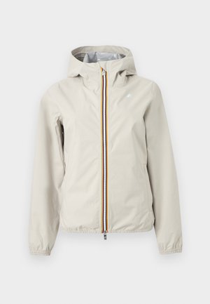 Helebeež kapuutsiga jakk esilukuga, millel on punased, kollased ja sinised triibud, elastsed varrukasäärtega ning väike logo rinnal.