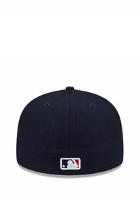 Navy blue fitted baseball cap with a rounded crown, featuring a small embroidered MLB logo in red, white, and blue on the back.