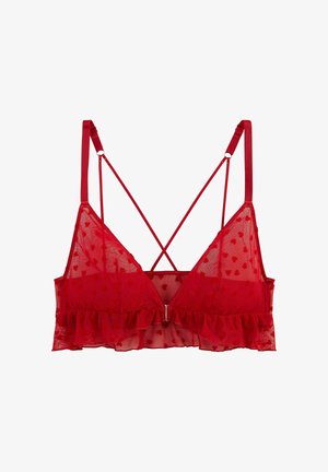 Bralette rouge transparent avec petits motifs de cœurs, bretelles ajustables, design dos croisé et détail de bord volanté.