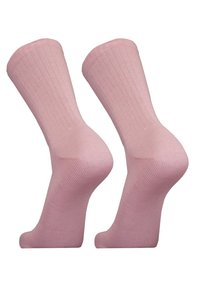 Knöchelhigh Socken aus einer Baumwollmischung in sanftem Rosa, mit strukturiertem Rippdesign und glatter Oberfläche, entworfen für Komfort und Dehnbarkeit.