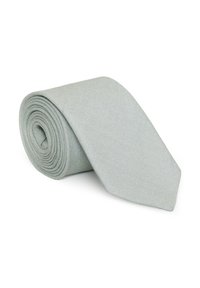 Svetlo šedá kravata, vyrobená z textilného materiálu, pekne zrolovaná. Má štandardnú šírku s špicatým koncom.
