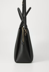 Black synthetic handbag with a structured shape, zipper closure, and dual handles crisscrossed at the top. Smooth texture and no visible patterns.