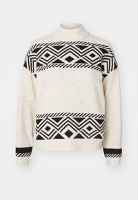 Un pull crème avec des motifs géométriques noirs en losanges et en rayures sur la poitrine, les poignets et l'ourlet, doté d'un col montant et de manches longues.