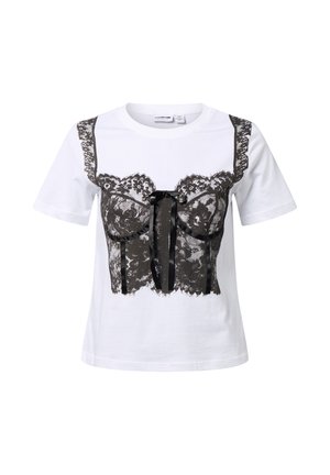 White t-shirt featuring a black lace graphic design resembling a corset, with a central black ribbon detail and textured lace accents.