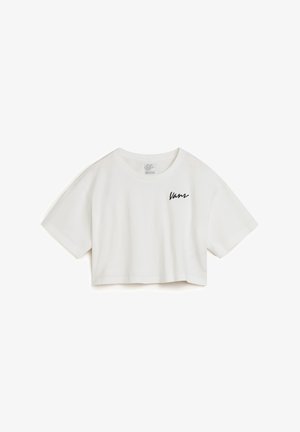 Witte cropped t-shirt van katoen met korte mouwen, voorzien van een zwart "Vans" logo geborduurd op de linker voorkant.