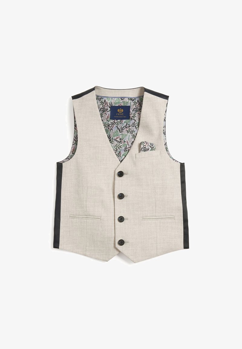 Gilet beige pour homme avec boutons noirs, panneaux latéraux noirs, doublure intérieure fleurie et pochette assortie à motif floral.