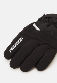 Black insulated gloves with a textured fabric, a reinforced palm, and a white logo accent. Features a gathered wrist for a snug fit.