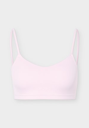 Bralette rosa chiaro senza cuciture con sottili spalline regolabili e logo "BORG" leggermente impresso al centro davanti.