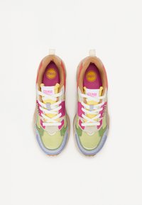 Multicolor sneakers featuring a mix of green, pink, yellow, and beige materials. Thick sole, padded collar, and prominent laces.