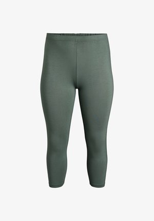 Vihreät, istuvat legginsit, joissa on joustava vyötärönauha. Sileä, joustava materiaali ulottuu keskivarsiin saakka. Saumaton muotoilu ilman taskuja tai koristeita.