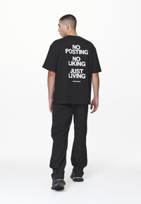 Pegador - DEVON OVERSIZED TEE - Apdrukāts T-krekls - black Miniatūras attēls 1