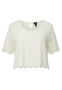 Bílý krajkový crop top s krátkými rukávy, zdobený květinovými vzory, s vlnkovaným lemem a detaily s klíčovou dírkou na zadním výstřihu.