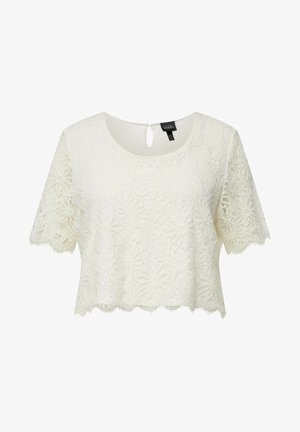 Top corto de encaje blanco con mangas cortas, con patrones florales, un dobladillo festoneado y un detalle de ojal en la parte posterior del cuello.