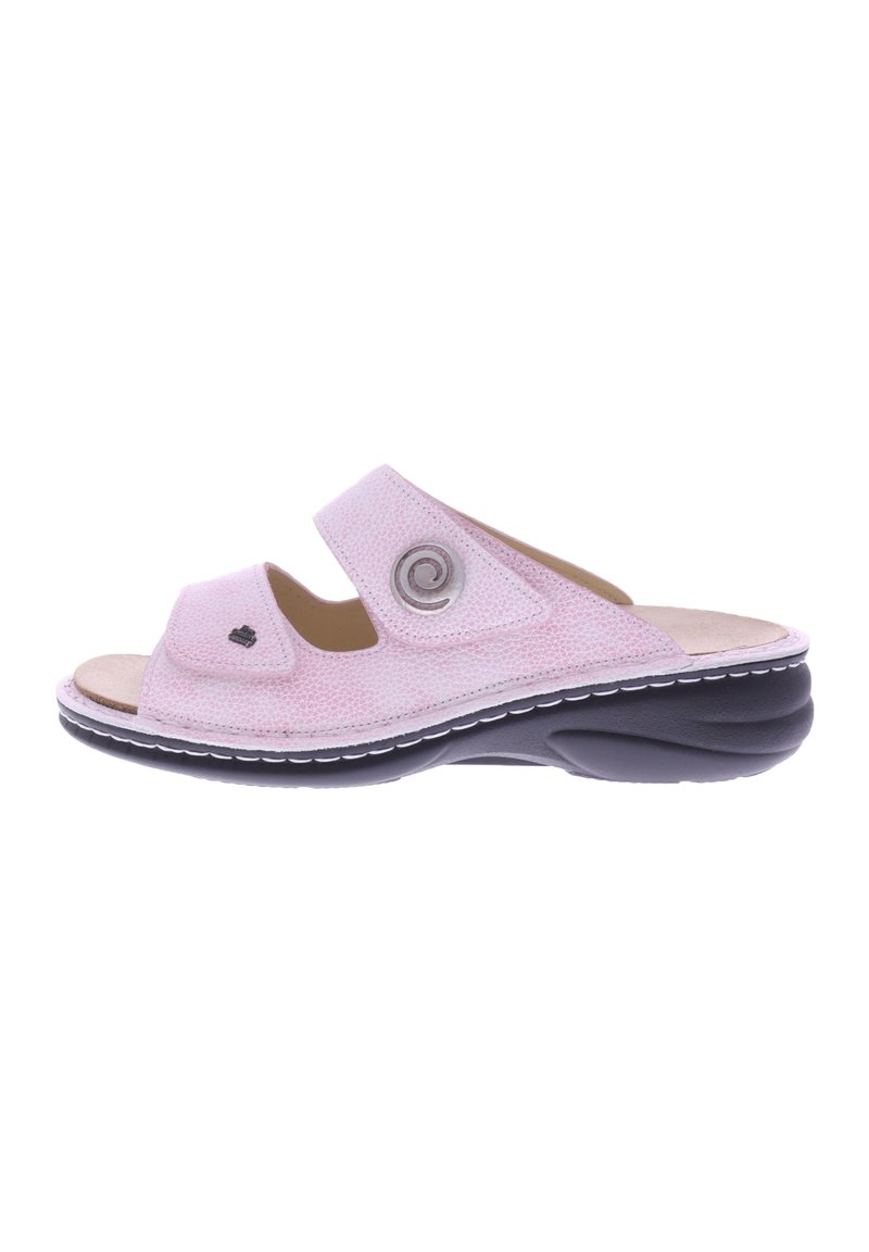 Pink fabric slide sandal with two adjustable straps, circular metal accent, and cushioned insole. Black outsole with white stitching detail.