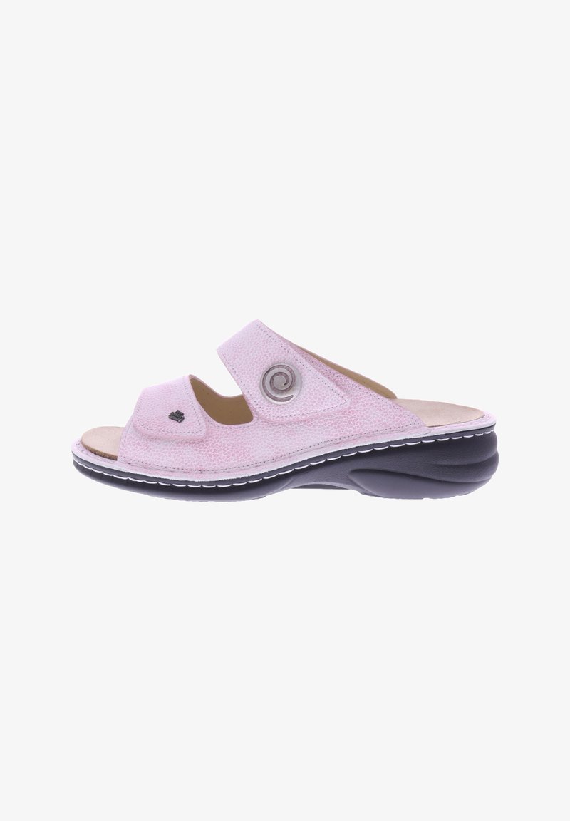 Pink fabric slide sandal with two adjustable straps, circular metal accent, and cushioned insole. Black outsole with white stitching detail.