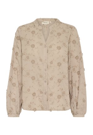 Beige button-up blouse with long sleeves, featuring floral embroidery, a mandarin collar, and gathered cuffs with small decorative details.