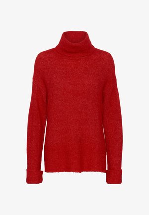 Punainen pooloneule, joka on neulottua kangasta. Ominaisuuksiin kuuluu löysä malli, pitkät hihat, joissa on ribbineulokset, sekä ribbireunus. Kankaan pinnassa on teksturoitu viimeistely.