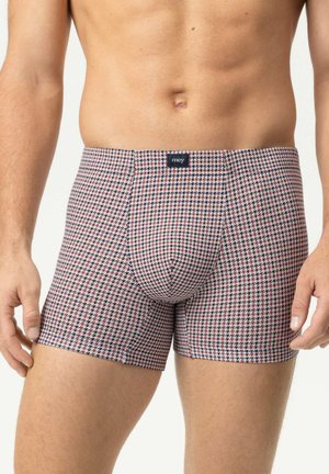 Männlicher Oberkörper, der eng anliegende Boxershorts mit kleinem Hahnentrittmuster in Rot, Schwarz und Weiß trägt, und einem mittigen Etikett mit der Aufschrift "mey".