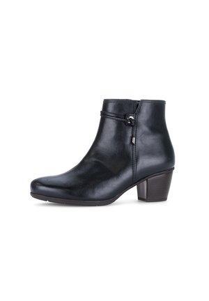 Black leather ankle boot with low block heel, decorative strap with metal accent around the upper ankle, side zipper closure.