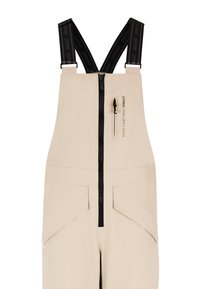 Beige waterdichte overall met verstelbare zwarte banden, voorrits en twee schuine zakken. Glad textuur en minimalistisch ontwerp.