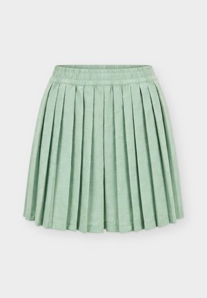Light green pleated skirt with an elastic waistband and subtle textured square pattern, laid flat on a white background.