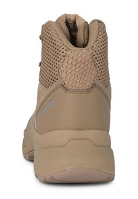 Brown waterproof ankle boot with mesh panels, textured accents, and a padded collar for comfort. Sturdy rubber sole with traction features.