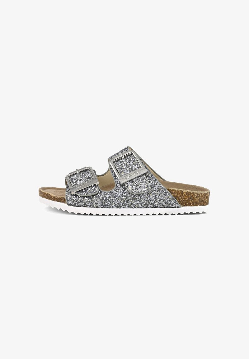 Glittery silver slide sandal with two adjustable buckles, cork footbed, and white serrated sole. Textured surface with sparkle finish.