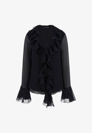Blusa negra hecha de tela transparente, con un escote y puños con volantes, mangas largas y una textura suave. Los volantes adornan la parte delantera.
