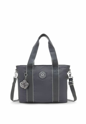 Dunkelgraue Tote-Tasche mit zwei kurzen Griffen, einem abnehmbaren Schulterriemen, einem kleinen Plüschaffen-Schlüsselanhänger und einem runden Kipling-Logo-Patch.