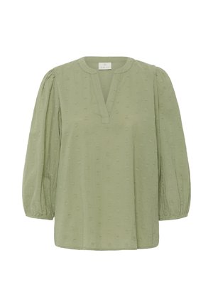 Light green blouse with a V-neckline, puff sleeves, and textured heart patterns. Made from soft, breathable fabric for comfort.