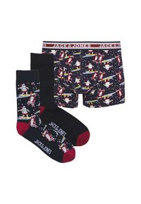 Ensemble de boxers et chaussettes pour hommes avec un motif sombre mettant en scène un Santa surfant, des flocons de neige blancs et des accents rouges contrastants.
