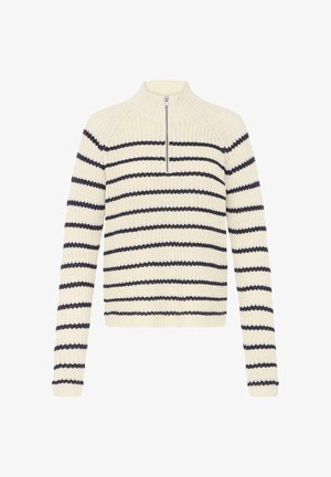 Švarkelis išnertas grietinėlės spalvos su tamsiai mėlynomis juostelėmis, turi pusiau užtrauktuką, ilgomis rankovėmis ir tekstūruotą raštą visame paviršiuje.