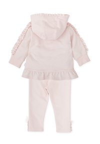 Conjunto de sudadera de algodón rosa y leggings a juego, con acentos con volantes en las mangas y el dobladillo, que presenta una textura suave y un diseño ajustado.