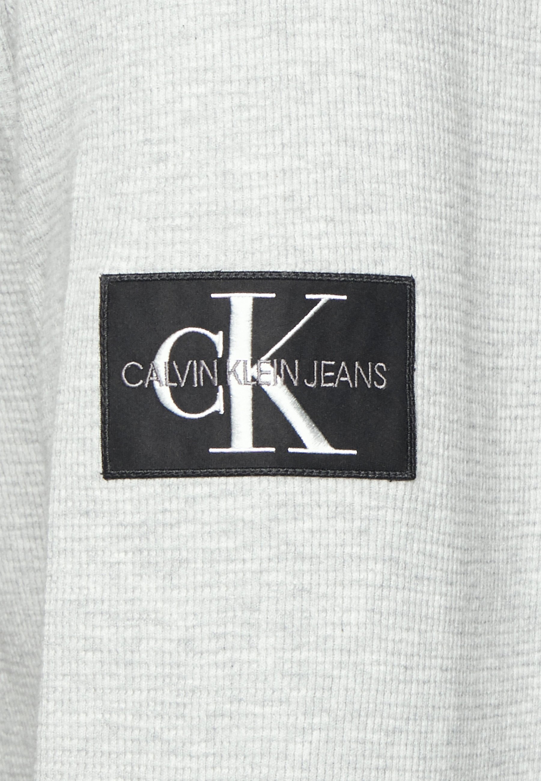 ck grey jumper