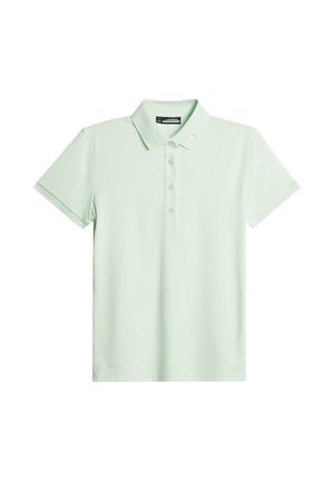 Polo shirt verde chiaro realizzato in tessuto morbido. Presenta una patta con tre bottoni, maniche corte e un dettaglio del logo sulla spalla.