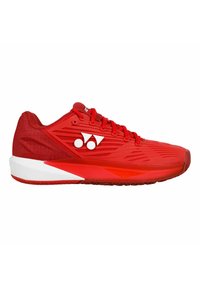 Scarpa sportiva rossa con tomaia testurizzata, design snello e dettagli bianchi. Presenta chiusura con lacci e suola rotonda.
