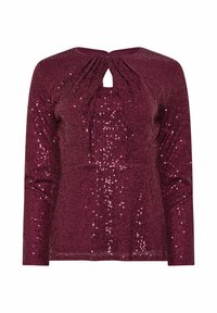 Top lungo bordeaux con maniche lunghe, scollatura a chiave e tessuto ricoperto di paillettes testurizzate e brillanti. Presenta delle pieghe per un tocco di dettaglio in più.