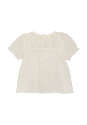 Blouse en coton blanc à manches bouffantes courtes, présentant un design floral brodé sur le devant et un col rond avec une petite fermeture à bouton.