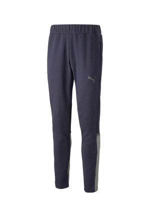 Marineblå sportsbukser med grå sideakcenter, elastisk talje og tapered fit. Fremstillet af blødt stof med en subtil glans og logodetalje.