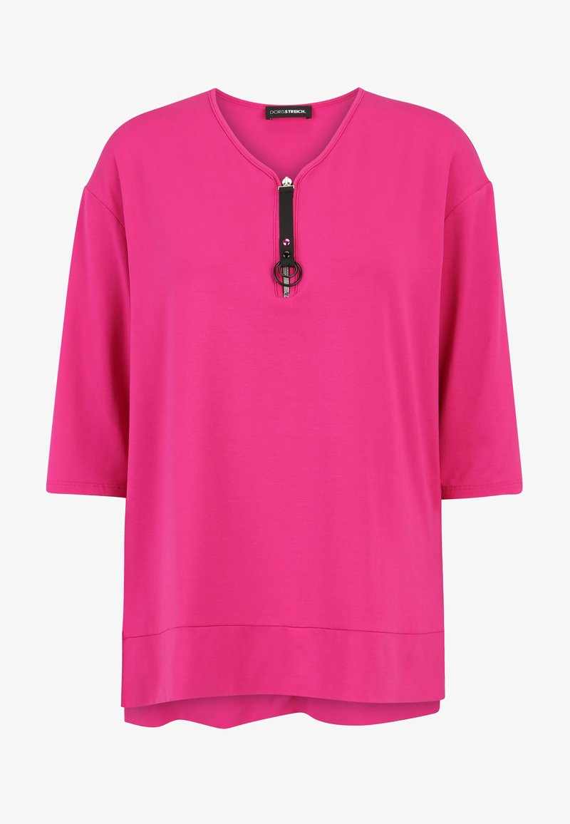 Fuchsia short-sleeve top with a V-neck and a black zip closure, featuring a circular accent. Made of smooth, lightweight fabric.