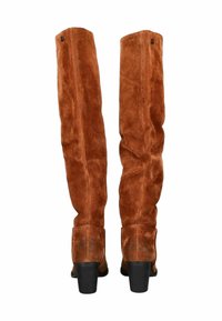 Rindswildleder-Stiefel über das Knie in sattem Braun mit strukturierter Oberfläche. Runde Zehenpartie, Blockabsatz und eine Nahtdetails an der Rückseite.