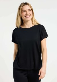 Zwarte top met korte mouwen en een ronde halslijn, in een ontspannen pasvorm. Bevat een subtiele textuur en zijzakken voor een functioneel ontwerp.