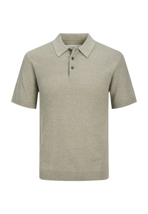 Kortermet polo-skjorte i lys grønn, teksturert strikket stoff, med krage og tre knapper ved åpningen. Rent design, ingen mønstre.